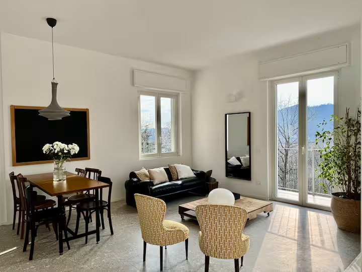 Bright living and dining room with lake view